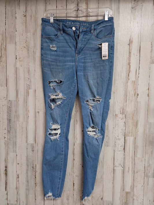 DENIM AMERICAN EAGLE SZ8 DISTRESS JEAN, LADIES M
